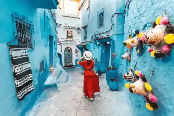 Travelers exploring Chefchaouen during a 10-day Morocco tour from Agadir