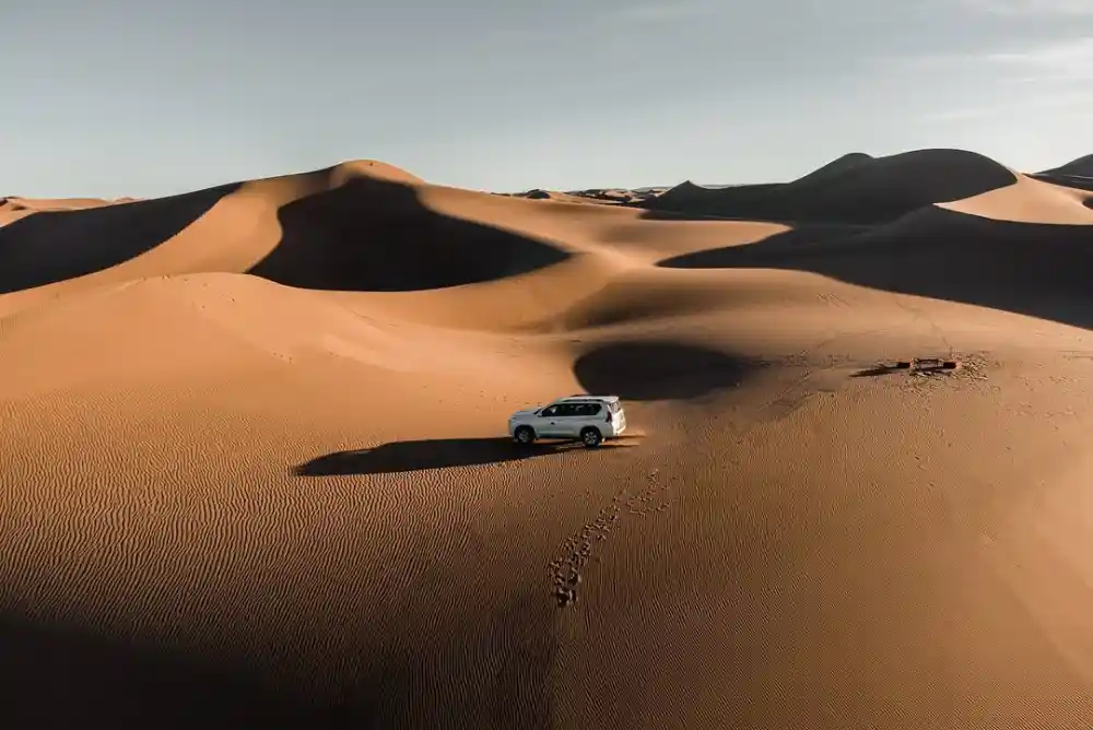 A 4x4 in the Erg Chebbi dunes on a 4-day desert tour from Fes