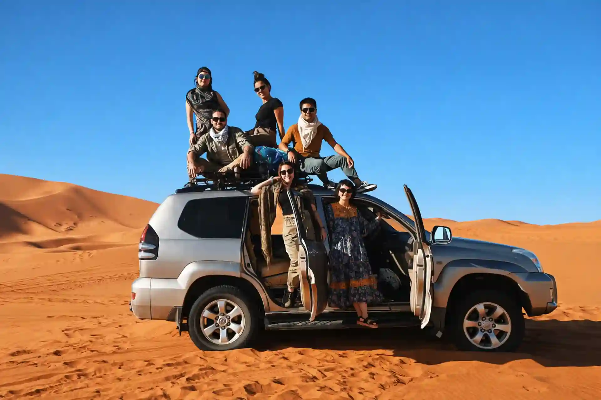 Family traveling through the Sahara on a 4-day Marrakech to Fes Morocco tour